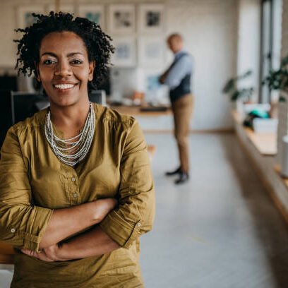 Portrait Of Cheerful Business Woman Standing at Office